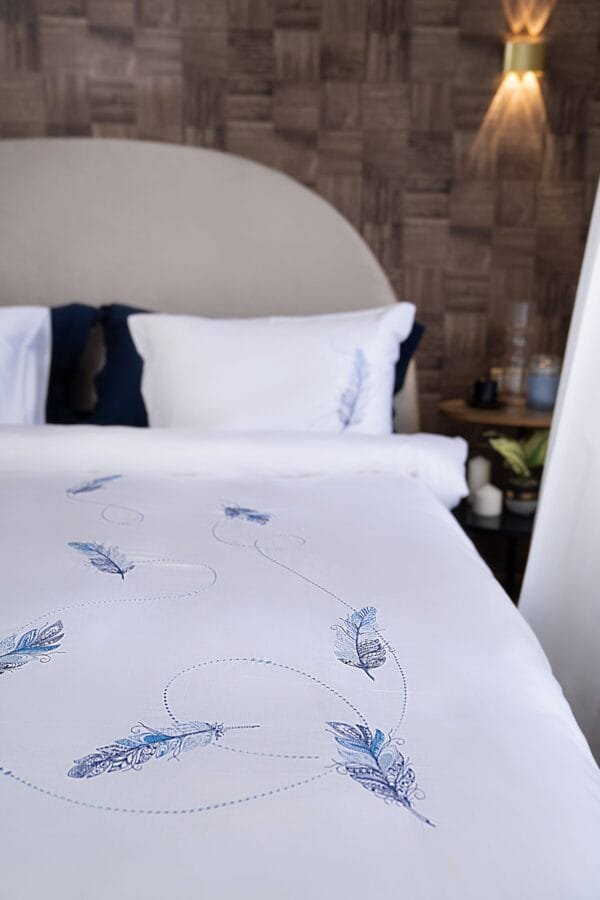 Blue feathers intertwined with enchanting patterns